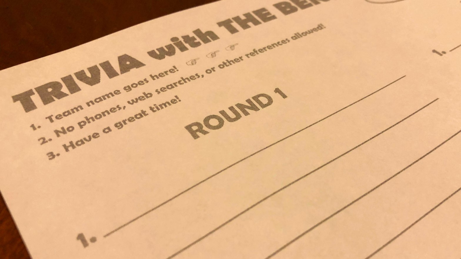 A photo of a blank trivia answer sheet. The center of the photograph reads "Round 1"